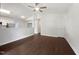 Open concept living and kitchen space with hardwood floors and neutral paint, providing a clean and airy feel at 216 E Hinton St, Clayton, NC 27520