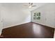 The living room features a high ceiling, with neutral paint, hardwood floors, and a view from the window at 216 E Hinton St, Clayton, NC 27520