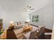 Bright living room with hardwood floors, neutral paint, and a large window, staged with modern furniture at 216 E Hinton St, Clayton, NC 27520