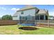 Spacious backyard with a trampoline, a wooden fence, and a view of the home at 240 Paddy Ln, Youngsville, NC 27596