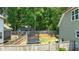 Fenced-in backyard featuring a trampoline, trees, and a view of the home at 240 Paddy Ln, Youngsville, NC 27596