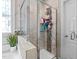 Tiled walk-in shower with glass enclosure at 240 Paddy Ln, Youngsville, NC 27596