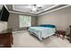 Comfortable bedroom with large window and tray ceiling at 240 Paddy Ln, Youngsville, NC 27596