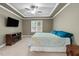 Tranquil bedroom with neutral tones, tray ceiling, and large window for natural light at 240 Paddy Ln, Youngsville, NC 27596