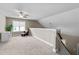 Spacious bonus room featuring neutral carpeting, a ceiling fan, and plenty of natural light at 240 Paddy Ln, Youngsville, NC 27596