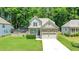 Charming home with a stone facade, two car garage and lovely front yard at 240 Paddy Ln, Youngsville, NC 27596