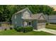 Charming two-story home with stone accents, covered porch, and manicured lawn at 240 Paddy Ln, Youngsville, NC 27596