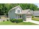 Charming two-story home with stone accents, a cozy front porch, and a lush green lawn at 240 Paddy Ln, Youngsville, NC 27596