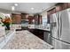 Gourmet kitchen featuring stainless steel appliances and granite countertops at 240 Paddy Ln, Youngsville, NC 27596