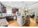 Spacious kitchen with an island and seating, seamlessly connected to the living room at 240 Paddy Ln, Youngsville, NC 27596