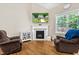 Living room features a fireplace and hardwood floors at 240 Paddy Ln, Youngsville, NC 27596