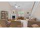 Inviting living room features a fireplace, large window and neutral decor at 240 Paddy Ln, Youngsville, NC 27596