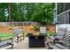 Relax and entertain on the patio with a cozy fire pit and comfortable seating area at 240 Paddy Ln, Youngsville, NC 27596