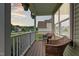 Inviting porch with wicker chairs and hanging flower baskets at 240 Paddy Ln, Youngsville, NC 27596