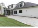 Charming two-story home with a stone patio and well-manicured lawn at 25 Alex Farm Ct, Zebulon, NC 27597