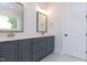 Elegant bathroom with double sink vanity featuring gray cabinets and quartz countertop with gold hardware at 25 Alex Farm Ct, Zebulon, NC 27597