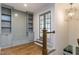 Inviting entryway with built-in shelving, bench seating, and a stylish light fixture at 25 Alex Farm Ct, Zebulon, NC 27597