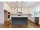 Gourmet kitchen featuring a large island, custom cabinetry, and modern finishes at 25 Alex Farm Ct, Zebulon, NC 27597