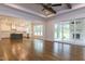 Open-concept layout with hardwood floors and a large sliding door to the outdoors at 25 Alex Farm Ct, Zebulon, NC 27597