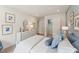 Bright bedroom featuring stylish decor, a comfortable bed, and ample storage space with closet at 27 Cribbs Ln, Middlesex, NC 27557