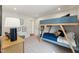 Bright bedroom features a gray and wood bunk bed with natural light and neutral colors at 27 Cribbs Ln, Middlesex, NC 27557