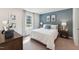 Comfortable bedroom with serene blue accent wall, complemented by stylish decor and soft lighting at 27 Cribbs Ln, Middlesex, NC 27557