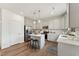Modern kitchen with white cabinets, stainless steel appliances, a central island, and hardwood floors at 27 Cribbs Ln, Middlesex, NC 27557