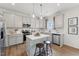 Bright kitchen featuring white cabinets, stainless steel appliances, and quartz countertops at 27 Cribbs Ln, Middlesex, NC 27557