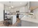 Modern kitchen with white cabinets, stainless steel appliances, a central island, and hardwood floors at 27 Cribbs Ln, Middlesex, NC 27557