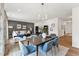 Open concept living room and dining area with stylish decor, hardwood floors, and plenty of natural light at 27 Cribbs Ln, Middlesex, NC 27557