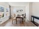 Bright home office featuring a large desk, comfortable chairs, and ample natural light from large windows at 27 Cribbs Ln, Middlesex, NC 27557