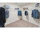 Organized walk-in closet featuring ample shelving and hanging space for clothes and accessories at 27 Cribbs Ln, Middlesex, NC 27557