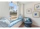 Cozy window seat offers a tranquil view of the outdoors with seating and natural light at 27 Cribbs Ln, Middlesex, NC 27557