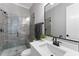 Modern bathroom featuring a glass shower with a built-in bench and stylish gray tile at 285 Mollie Meadow Dr, Zebulon, NC 27597