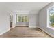 Spacious bedroom with beautiful hardwood floors and large windows providing plenty of natural light at 285 Mollie Meadow Dr, Zebulon, NC 27597