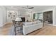 Bright living room with hardwood floors, built-in shelving, and a fireplace at 285 Mollie Meadow Dr, Zebulon, NC 27597