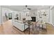 Bright living room with hardwood floors, built-in shelving, and a fireplace at 285 Mollie Meadow Dr, Zebulon, NC 27597