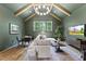 Cozy living room with vaulted ceiling, wooden beams, and stylish decor creating a comfortable space at 285 Mollie Meadow Dr, Zebulon, NC 27597