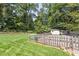 Picturesque backyard with lush greenery, a garden, and a shed, offering a tranquil retreat at 2913 Anderson Dr, Raleigh, NC 27608