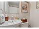 Cozy bathroom features a white sink, wood accents, and decor at 2913 Anderson Dr, Raleigh, NC 27608
