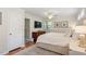 Comfortable bedroom features a large bed, ceiling fan, and a neutral color palette at 2913 Anderson Dr, Raleigh, NC 27608