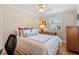 Bedroom with hardwood floors, a ceiling fan, and bright window view at 2913 Anderson Dr, Raleigh, NC 27608