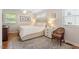 Cozy bedroom showcases a comfortable bed, hardwood floors, and bright natural light at 2913 Anderson Dr, Raleigh, NC 27608