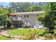 Charming home exterior with a deck, landscaped yard, and a patio area for outdoor enjoyment at 2913 Anderson Dr, Raleigh, NC 27608