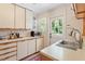 Functional kitchen features ample countertop space and white cabinets at 2913 Anderson Dr, Raleigh, NC 27608
