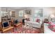 Comfortable living room with hardwood floors, white sofas, and a decorative rug at 2913 Anderson Dr, Raleigh, NC 27608
