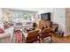 Cozy living room with neutral walls, hardwood floors, and a large window for natural light at 2913 Anderson Dr, Raleigh, NC 27608