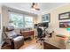 This bright office features hardwood floors, two desks, and a nice view of nature at 2913 Anderson Dr, Raleigh, NC 27608