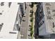 Aerial view of building's parking area and rooftop on a clear, sunny day at 317 W Morgan St # 320, Raleigh, NC 27601
