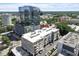 Building exterior with cityscape background and parking decks on a sunny day at 317 W Morgan St # 320, Raleigh, NC 27601